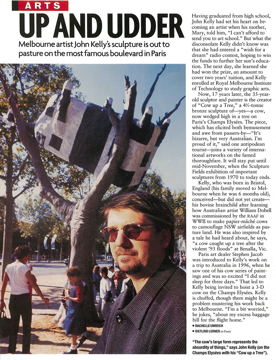 One-page magazine article from 1999 called ‘Up and Udder’. In the photo on the left, JK is in the foreground, head and shoulders, with Cow up a a Tree a few metres behind; schoolkids are standing around the sculpture